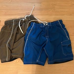 FOUR Men’s bathing suits three are speedo in medium and one is zero xposure.